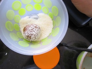 coconut balls - cover with coconut